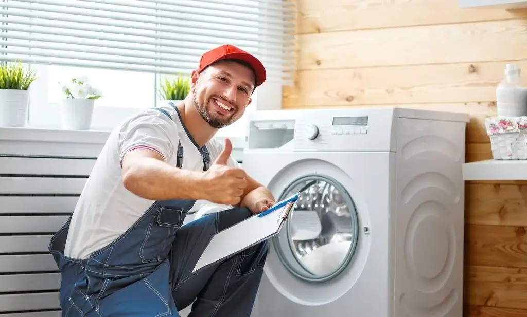 Technician Repairing Washing Machine